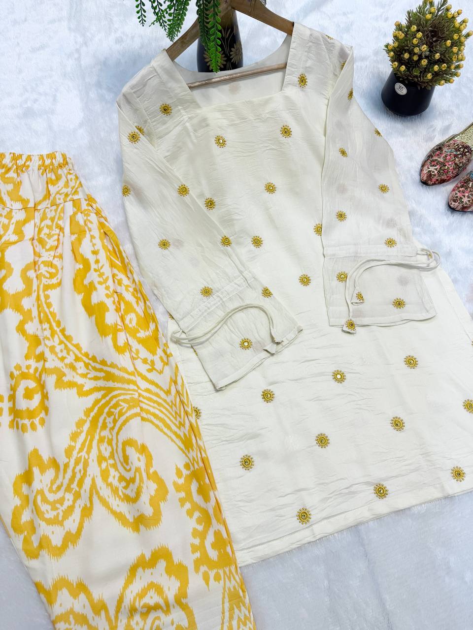 Radiant Ivory White Short Kurti Adorned with Sunshine Yellow Embroidery Paired with a Flowy Patterned Farshi Salwar